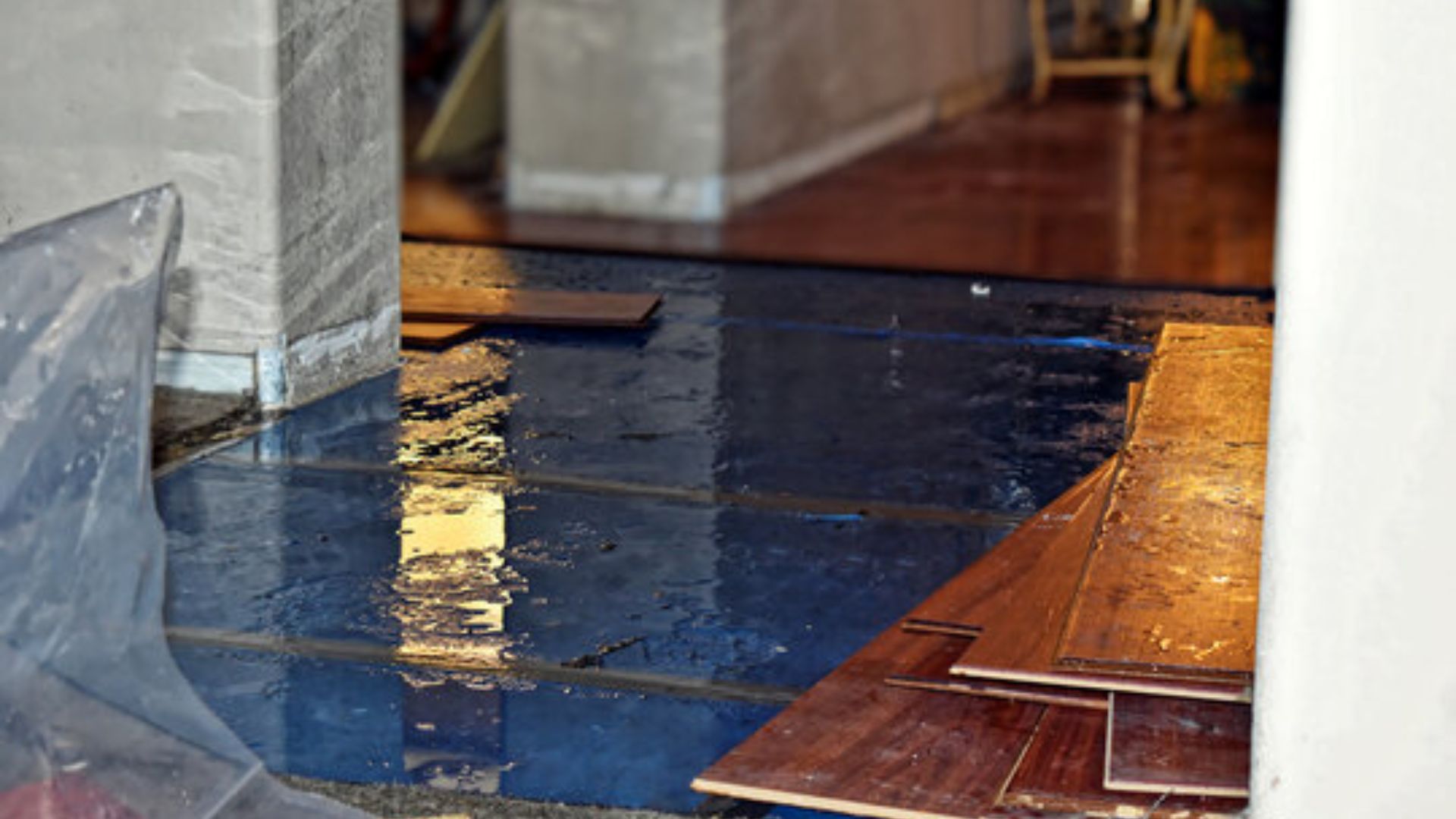 Water damage in Easley, SC home with flooded flooring and restoration materials.