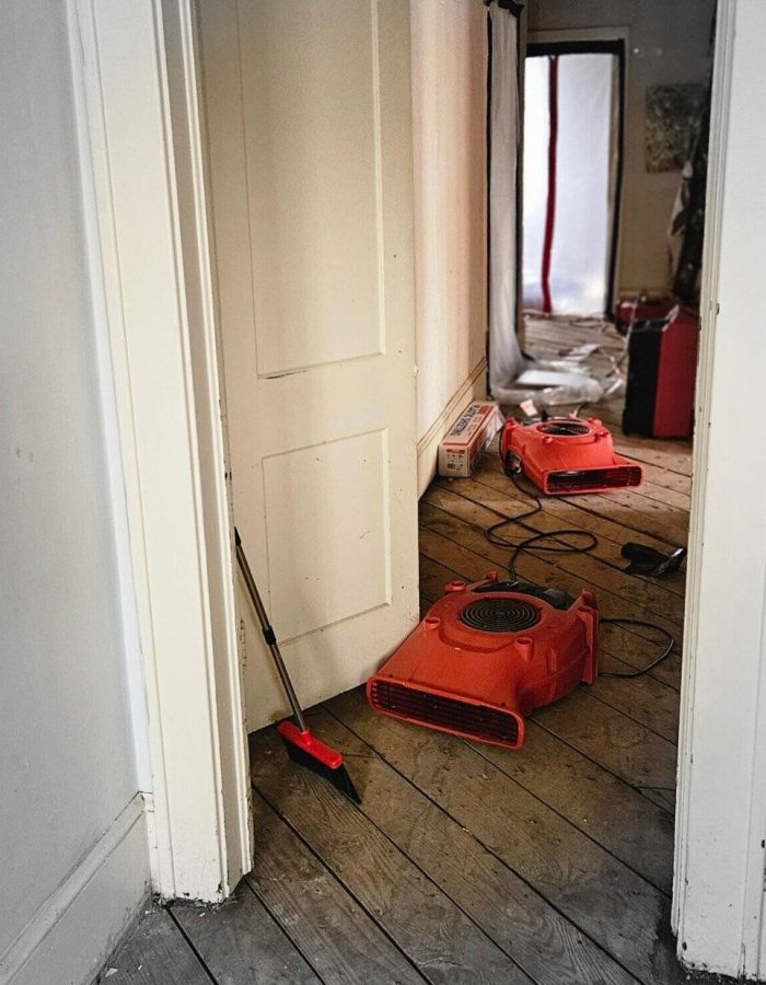 Hallway with drying equipment after wet flooring removed